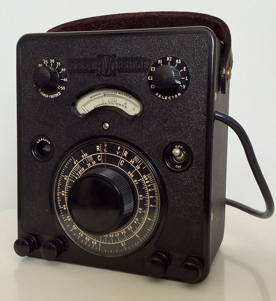 <b>AVO Test Bridge</b> (1944) : Figure 97 : Avo Test Bridge, this fine piece of equipment tests capacitors, resistors, leakage of capacitors, power factor, measures against external standards, and last but not least its a vacuum tube volt meter, quite impressive for 1944. This instrument is the traditional Wheatstone Bridge, used to measure resistance and capacitance. The single tube is a triode, type L63, in an octal socket. : 