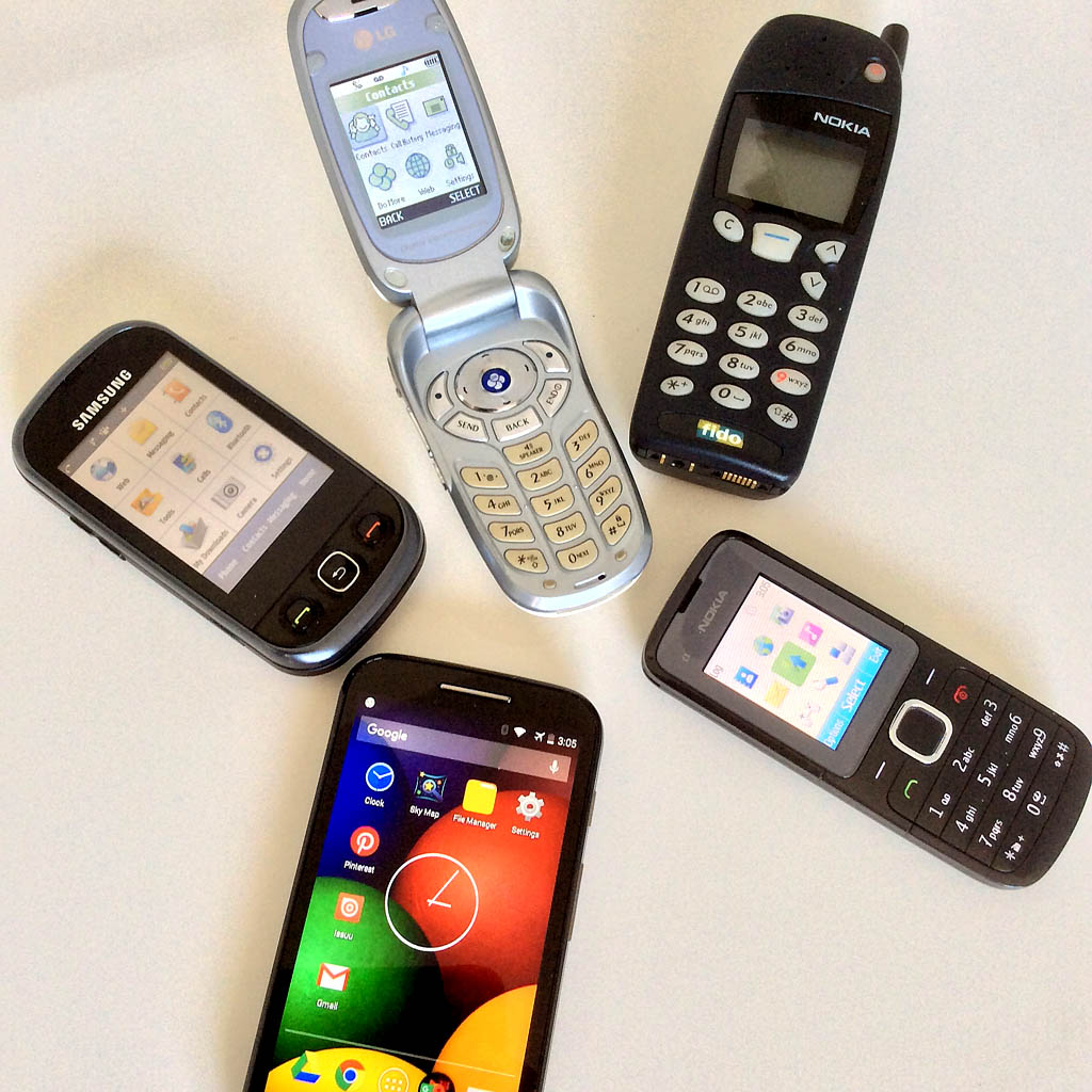 <b>Vintage Cell Phones</b> (2001) : Figure 162 : A bunch of cell phones that I used in a past life. Favorite, the Samsung Flip, that looks like a Star Trek communicator. : 